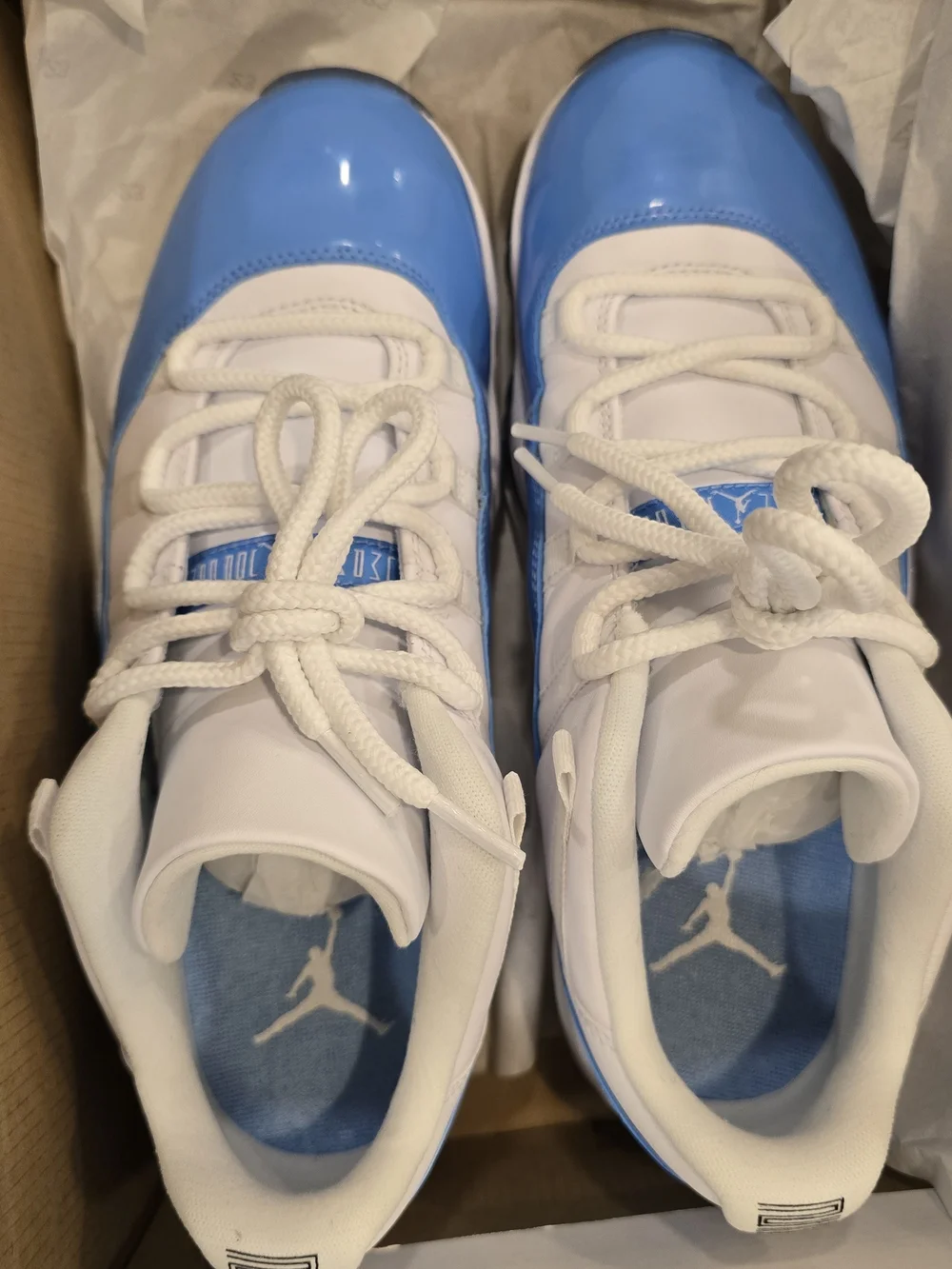 Air Jordan 11 Low Retro White and University Blue Sneakers